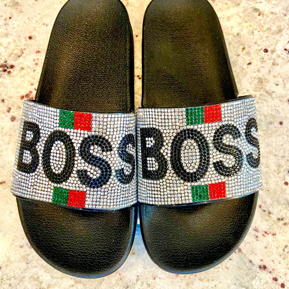 Boss slides. One rhinestone missing on each shoe.